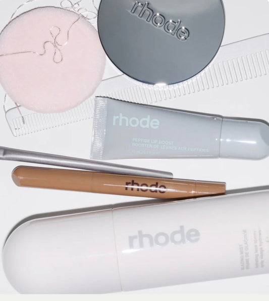 Rhode Skin minimalist skincare products including Peptide Glazing Fluid and Barrier Restore Cream